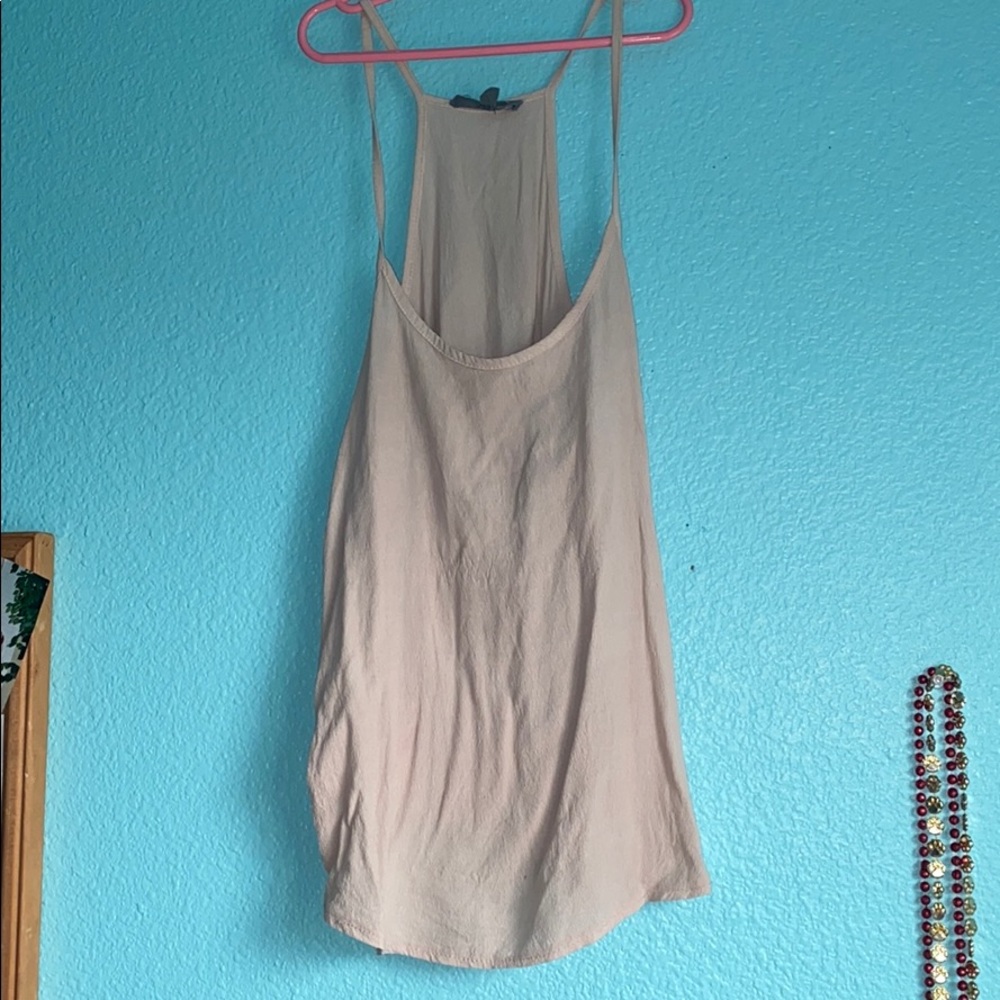 Brand is Don’t Ask Why that is a tan tank top